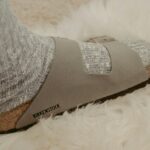 gray and brown sock on white textile